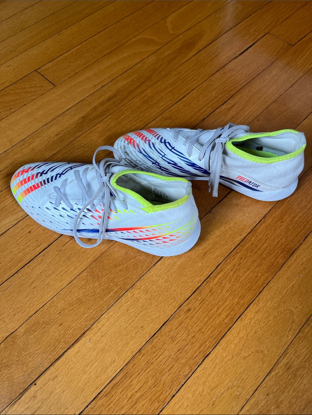 adidas Kids White Indoor Soccer Boots with Neon Yellow, Orange, and Blue Accents